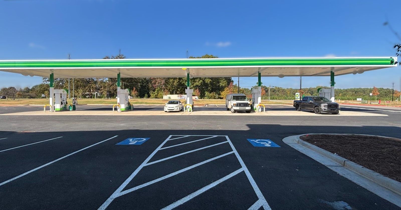 The fuel canopy and pumps at the McDonough store on a clear day