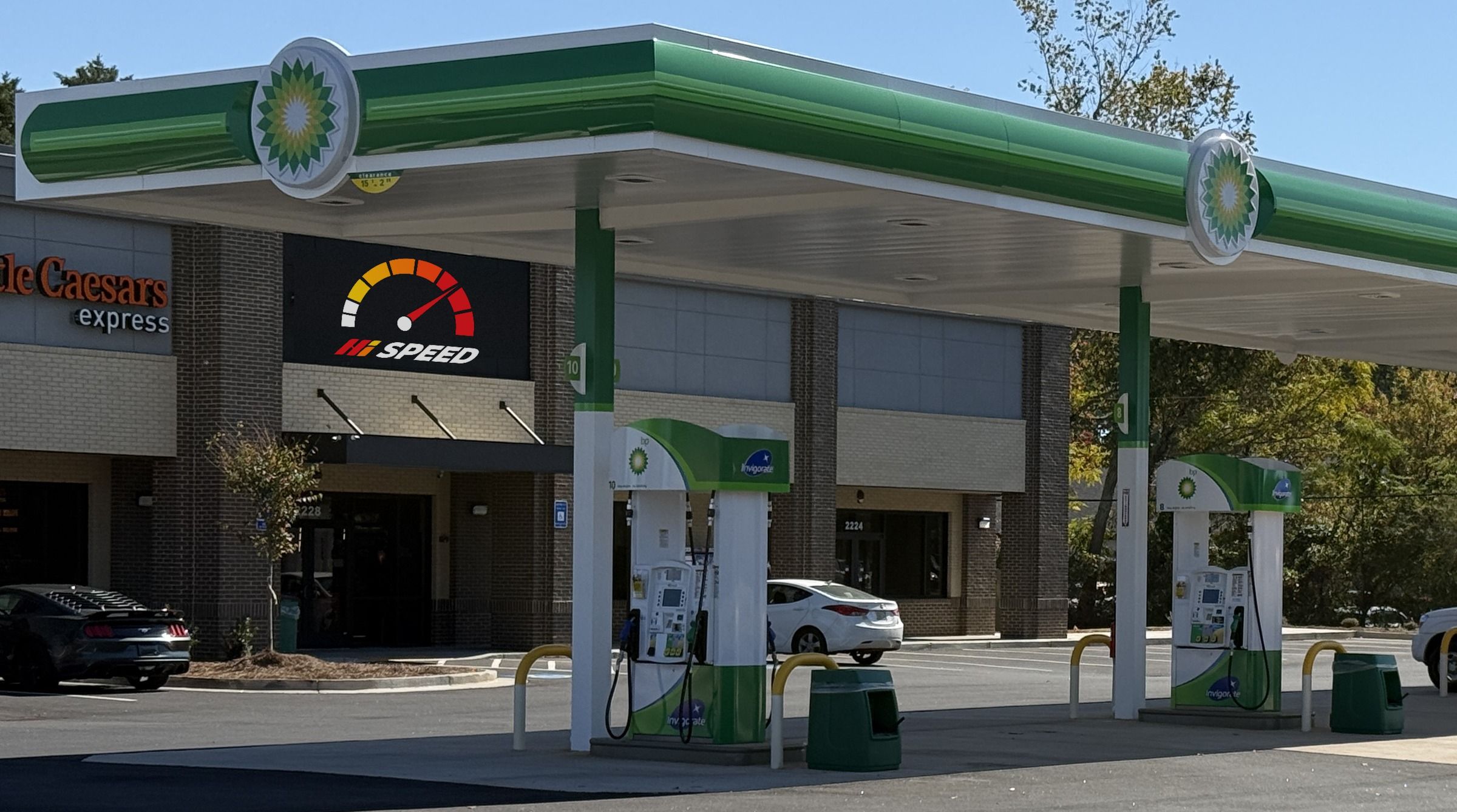 The Hi Speed sign on the store under the fuel canopy